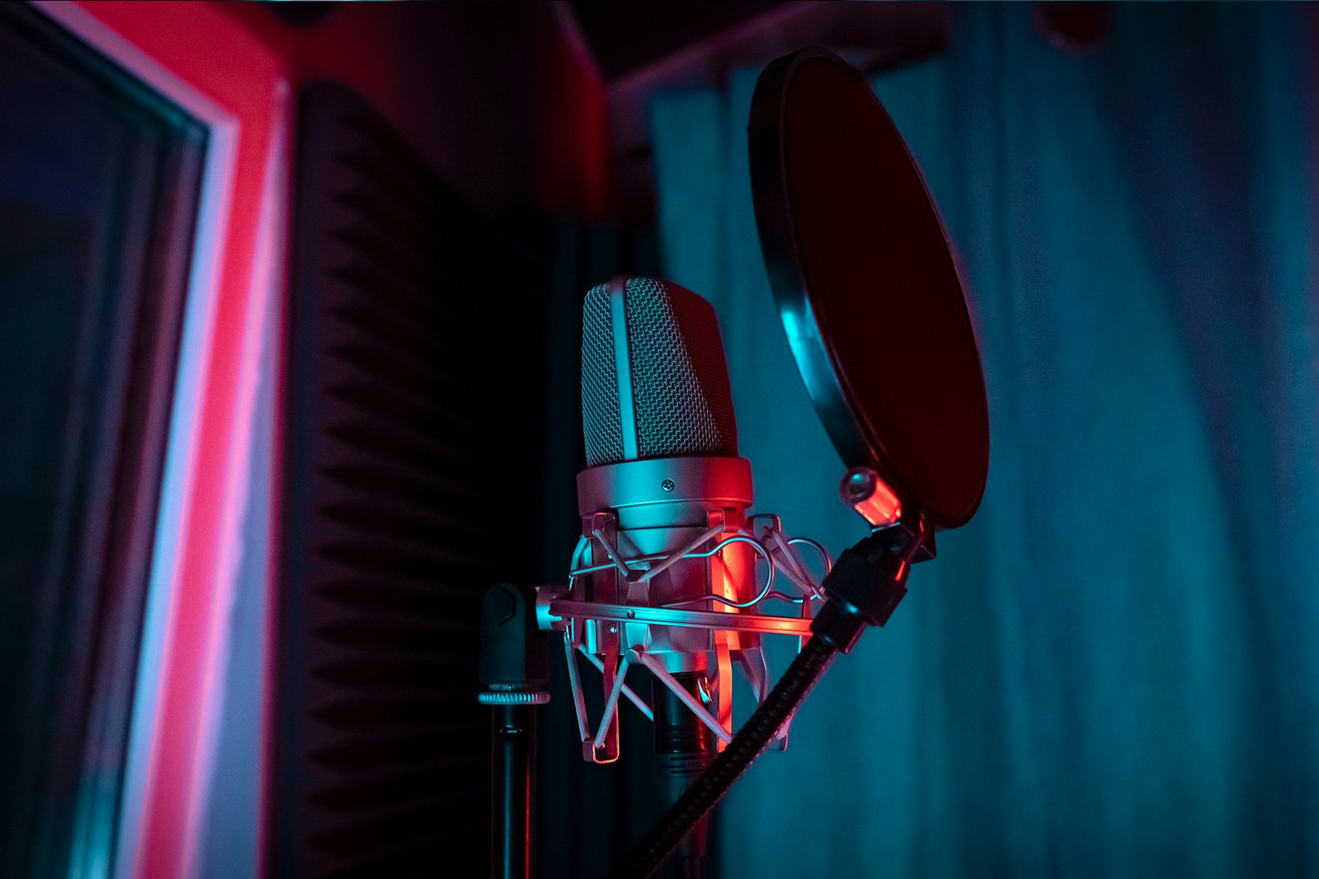 a microphone with a red light shining on it